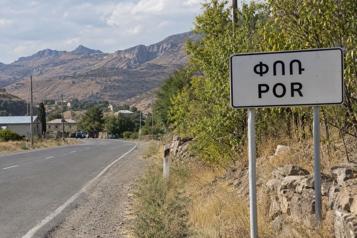 Por